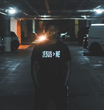 Man in Parking Garage Wearing Jesus Shirt